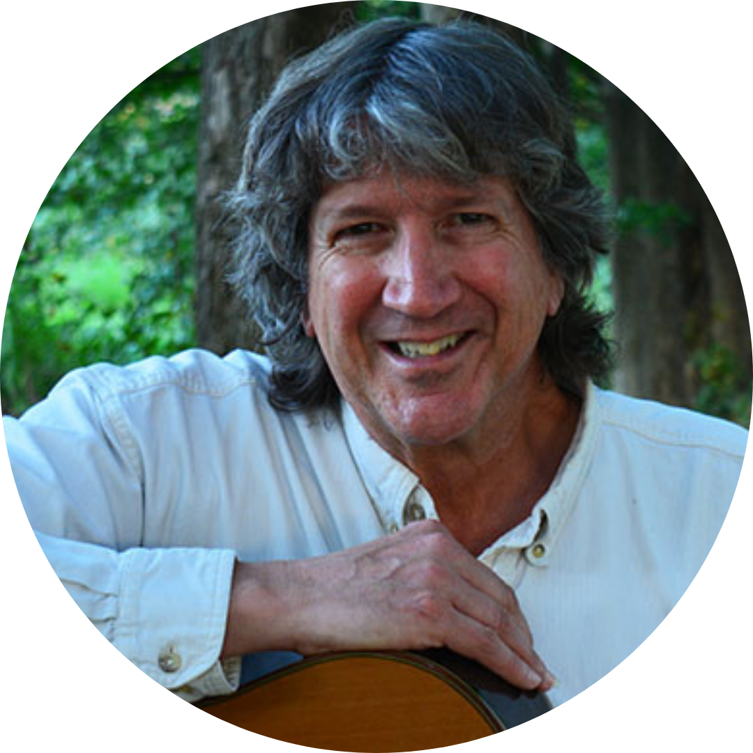 A headshot of David Cullen with his guitar.