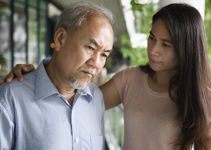 Adult child helping parent