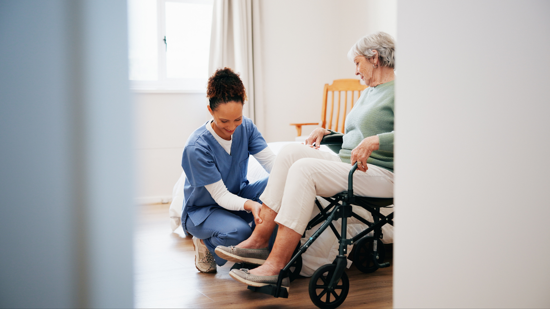 elderly woman recieving rehabilitation support from a caregiver