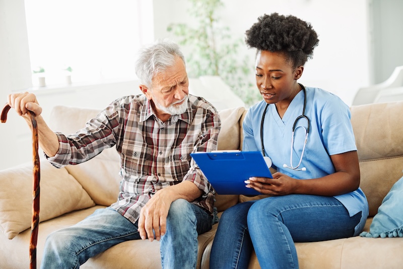 nurse caregiver with an elderly man
