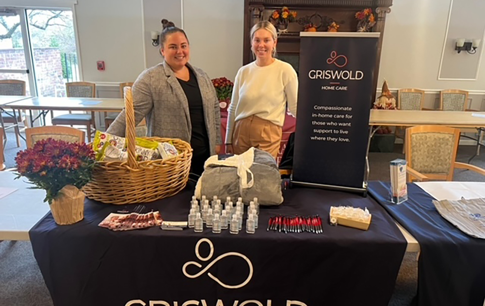 A group picture of two of our team members at a Griswold table.