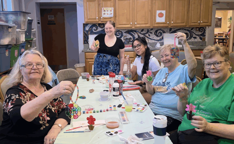 One of our team members, Natalie, making crafts with some of the residents at Schoolhouse Center