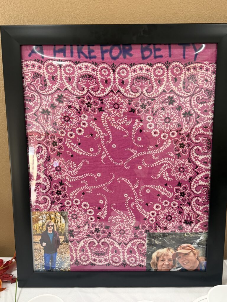 Tracey Lassett's mother's pink handkerchief, which she had worn on many hikes, to the cafe.