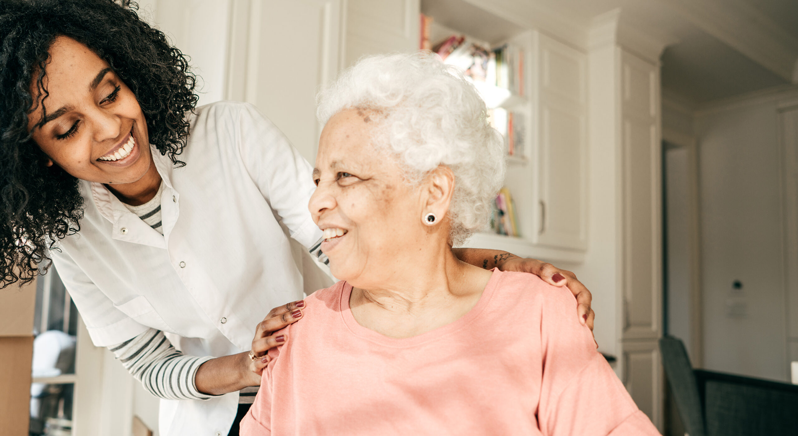 Nurse visiting senior lady at home
