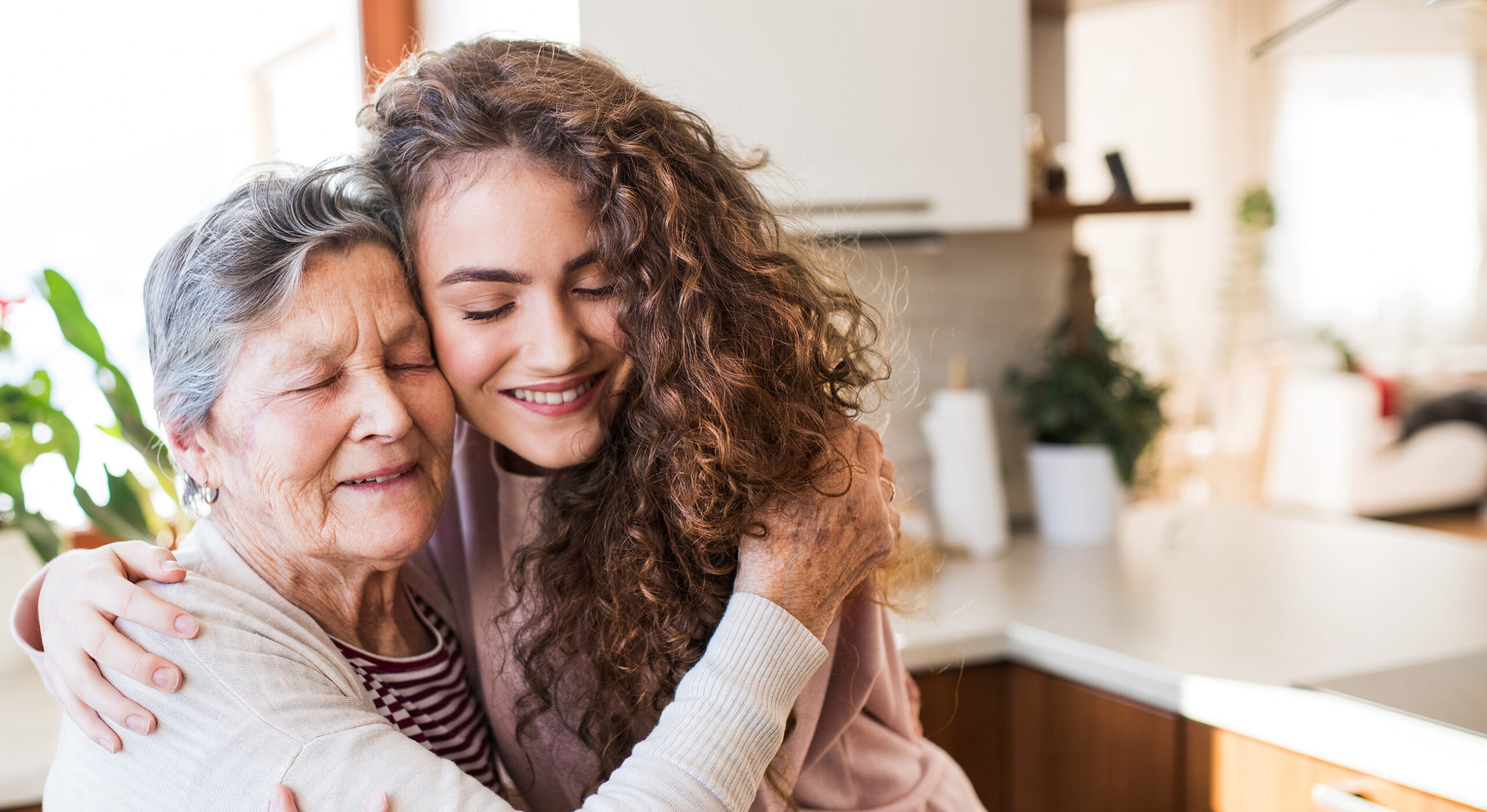Nurse visiting senior lady at home
