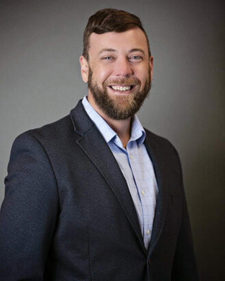 Brandon Harrison Headshot in business professional attire
