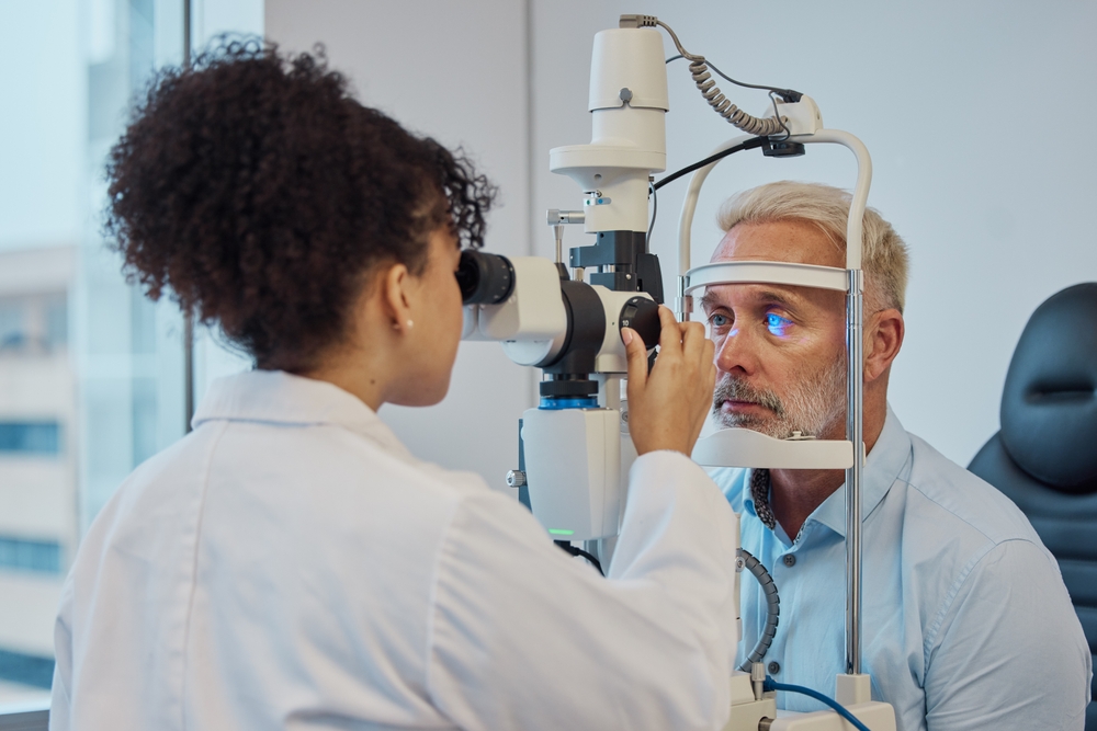 An eye doctor examines a patient